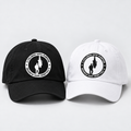 Black and white baseball caps with the official circular logo
